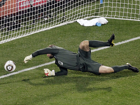 Shot bounces off Robert Green's hands and into the net in the U.S. vs. England's 1-1 tie. (Sohn/AP Robert)